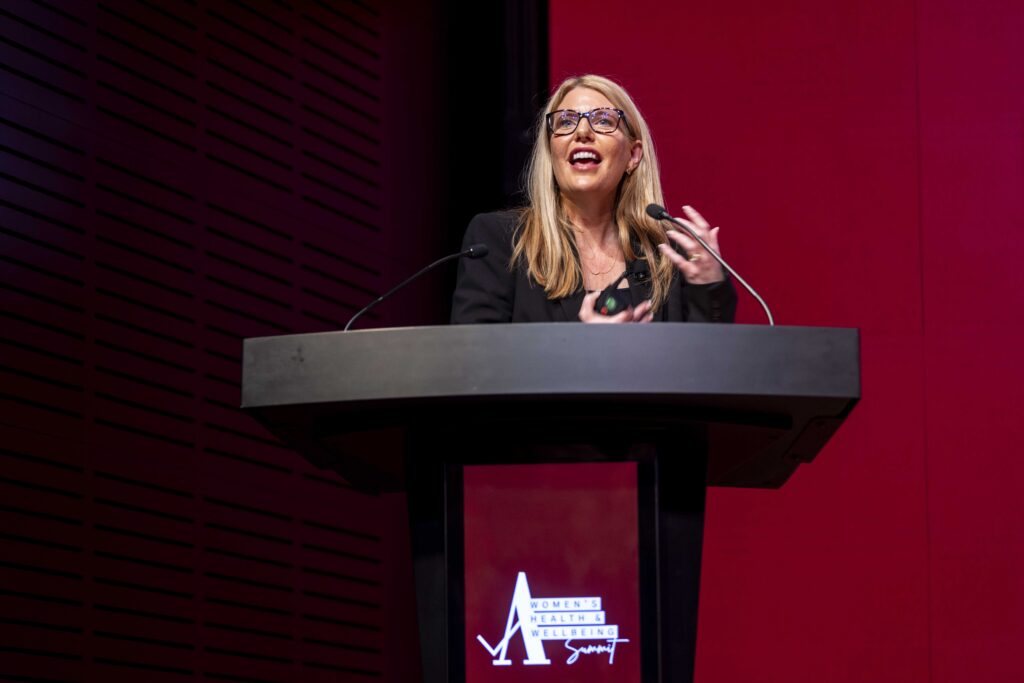 Ruth Limkin speaking at a lectern